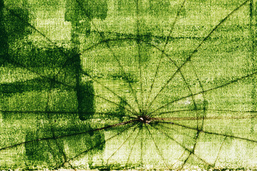 Crack pattern on broken green glass surface