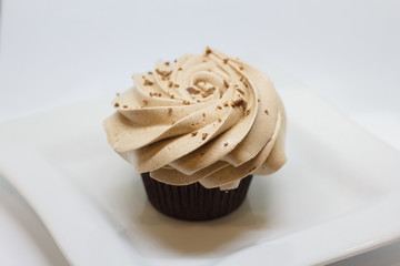 Chocolate cupcakes isolated on white. Selective focus