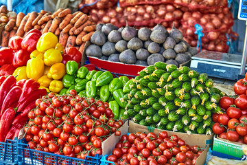 market with various colorful fresh fruits and vegetables