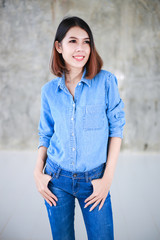Asian woman casual outfits standing in jeans and blue denim shirt, women brown hair and short hair, beauty and fashion jeans concept - 162383253