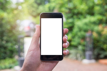Close up of a man hand holding smart phone with blank screen mobile in gargen.