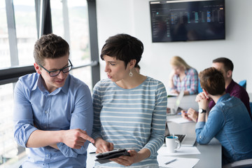 Two Business People Working With Tablet in office