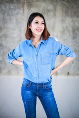 Asian woman casual outfits standing in jeans and blue denim shirt, women brown hair and short hair, beauty and fashion jeans concept - 162384624