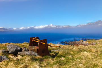 Fototapeta premium Old rusty mechanism on the shore of the fjord in eastern Iceland