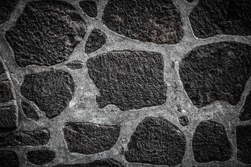 Fototapeta premium Texture of natural stones on the wall of traditional Iceland house for background. Toned