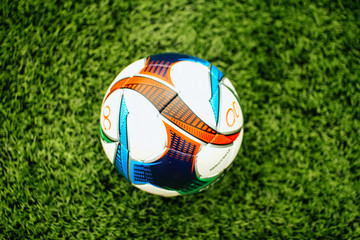 Plakat Soccer ball on grass grass on a football field