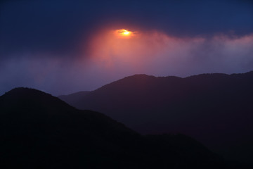 mountain range tropical rainforest canopy at southern of Thailand with more  cloud sunset time