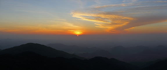 mountain range tropical rainforest canopy at southern of Thailand with more  cloud sunset time