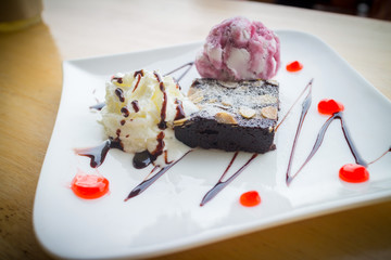 Homemade brownies with vanilla ice cream and whipped cream