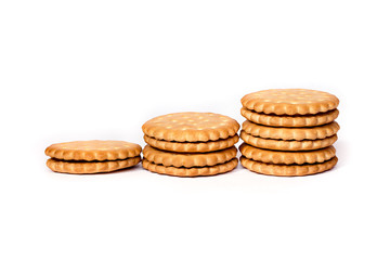 A stack of cicle biscuits puff sandwich cream isolated on white