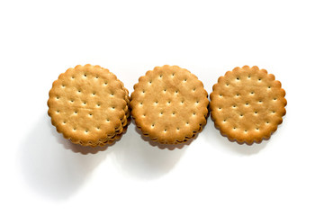A stack of cicle biscuits puff sandwich cream isolated on white