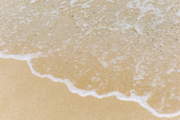 Sea view early summer with light waves, sunlight reflection, turquoise waters and fine yellow sand on the Bulgarian beach. Nostalgia. Concept Summer. Negative space.