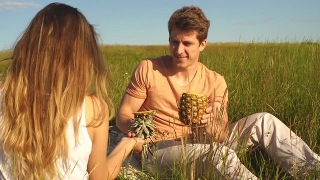 dad at the picnic cut up pineapple