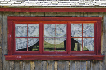 Old Log Cabin Window with Lace Curtains