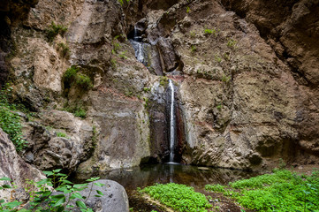 Tourists at Barranco del Infierno waterfall