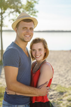 Attractive loving young couple on a beach