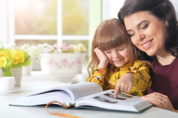 Mother reading  with her daughter