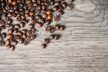 Coffee beans concept on wooden table background.