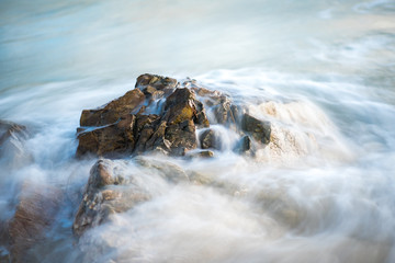 Water flowing over a detailed rock formation in the atlantic ocean