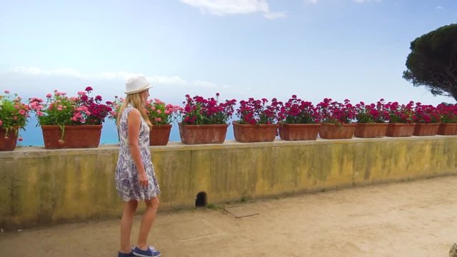 young blonde woman walking in Ravello at Italy