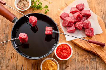 Tender prime beef being cooked in a fondue