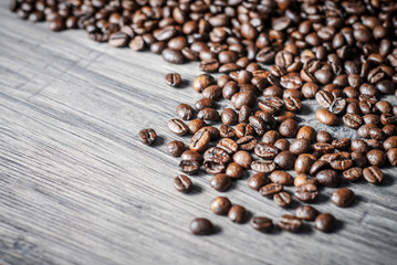 Coffee beans concept on wooden table background.