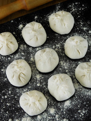 Raw khinkali, Georgian traditional dish, covered with flour
