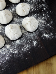 Raw khinkali, Georgian traditional dish, covered with flour