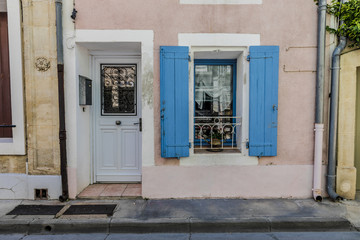 Pink french house with blue shutters at french small town southern France