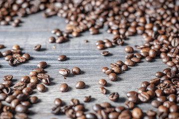 Coffee beans concept on wooden table background.