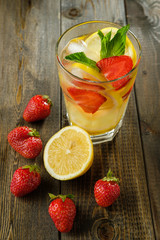 Lemonade with lemon and strawberry, mint and ice