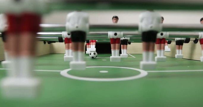 4K Close-up view table soccer kicker football figures.
