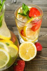 Lemonade with lemon and strawberry, mint and ice