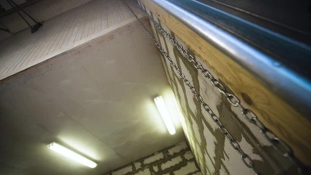 Big metal steal garage workroom chain hanging in the air
