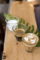 The ingredients of coffee on a wooden desk