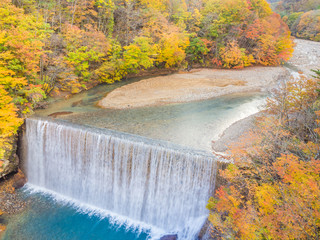 Beauty in nature. Waterfall and Autumn or fall color mountain