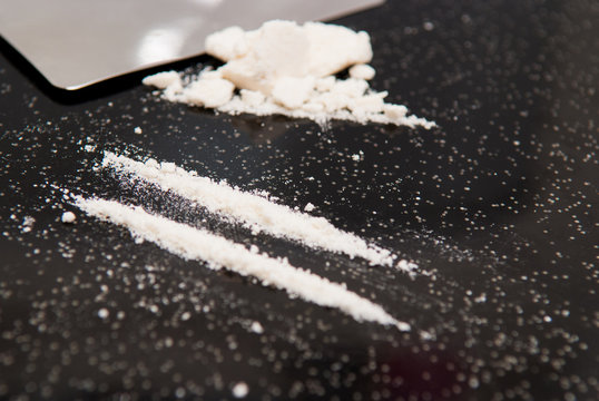 Drug abuse, cocaine chopped and in lines to be taken
