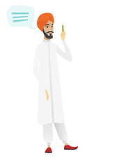Young hindu businessman with speech bubble.