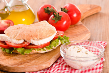 Puccia bread with mozzarella and tomato.