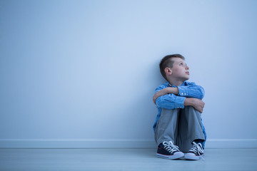 Child sitting on a floor
