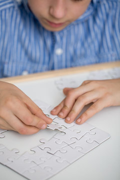 Boy solving a puzzle