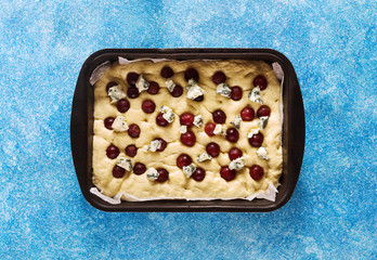Italian homemade fresh focaccia bread with grapes, gorgonzola cheese and honey. Refined appetizer...