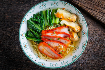 Chinese food : noodle dumpling with parsley and roasted red pork