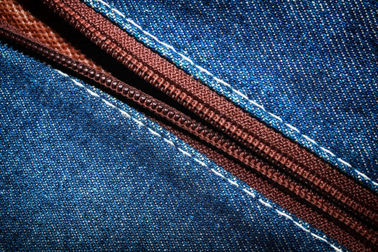 Blue denim jeans texture background with zipper,close up,select focus with shallow depth of field