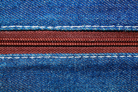 Blue denim jeans texture background with zipper,close up,select focus with shallow depth of field