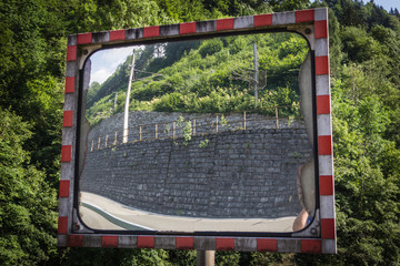 Obraz premium a traffic mirror with reflection, reflection, traffic, mirror, wall, street, road, reflex, mirroring, speculum examination, road safety, roadworthiness
