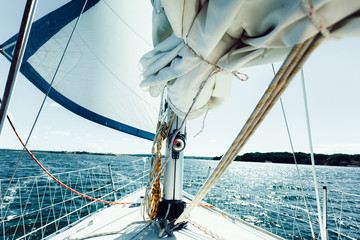 Yachting on sail boat during sunny weather