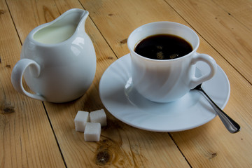 Coffee with milk on a wood table