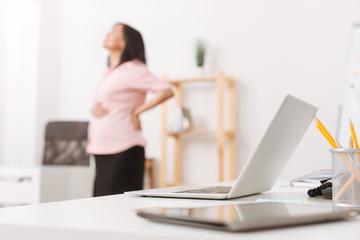 Fototapeta premium Selective focus of a laptop standing in the office