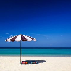 Umbrella, mattress and pillow on the beach, Phuket, Thailand.